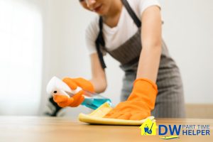 person-cleaning-the-table-part-time-cleaner-vs-full-time-cleaner-in-singapore-when-should-you-hire-part-time-cleaner-dw-part-time-helper-singapore